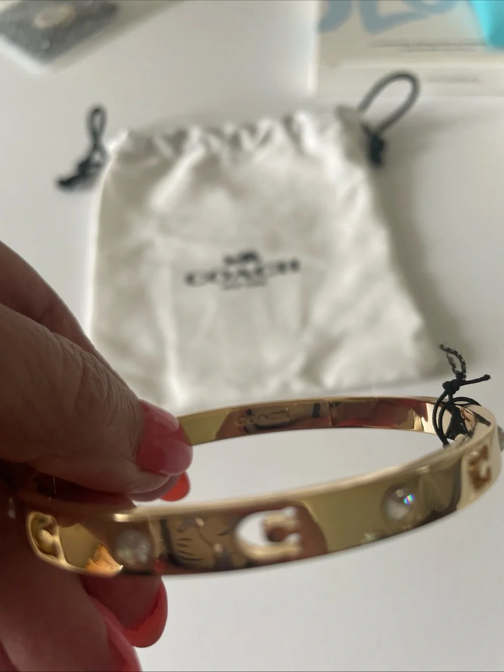 Coach  Gold Tone with crystals Slim Hinged Bangle